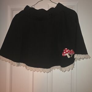 Elegant Black Mini Skirt with Red Mushroom Detail